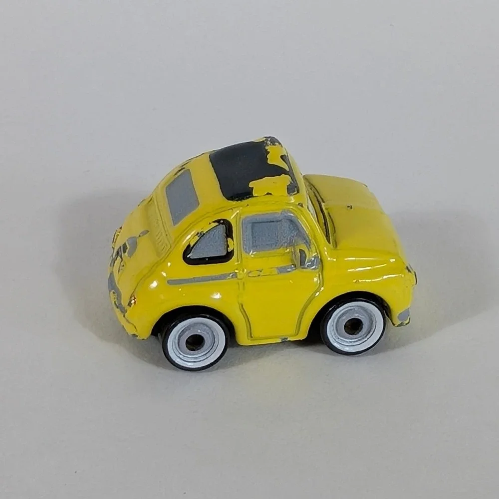 Disney Pixar Cars Luigi Fiat 500 Yellow Micro Drifters Mattel FBX66 Mini Racers